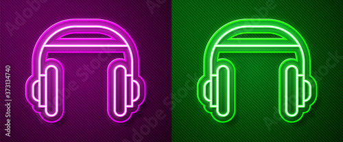 Glowing neon line Headphones icon isolated on purple and green background. Support customer service  hotline  call center  faq  maintenance. Vector Illustration.