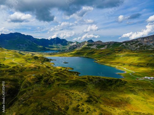 Wonderful Mountain Lake called Tannensee in the Swiss Alps - aerial photography