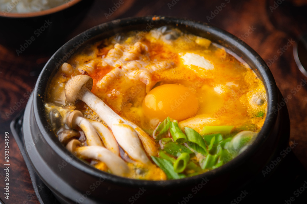 Sundubu, korean hot stone pot with tofu and pork