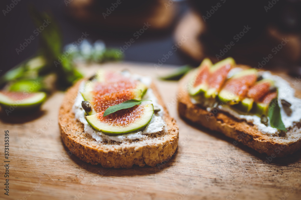 closeup of toasts with ricotta and figs closeup of toasts with ricotta and figs
