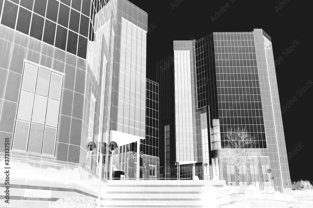 Fototapeta premium Abstract image of a modern office building. Black and white negative inverted image.