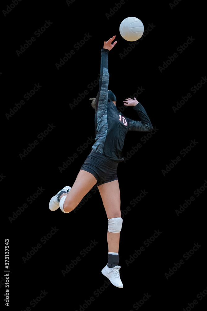 Girl athletes playing volleyball during Covid-19, wearing masks for protection Girl athletes playing volleyball during Covid-19, wearing masks for protection