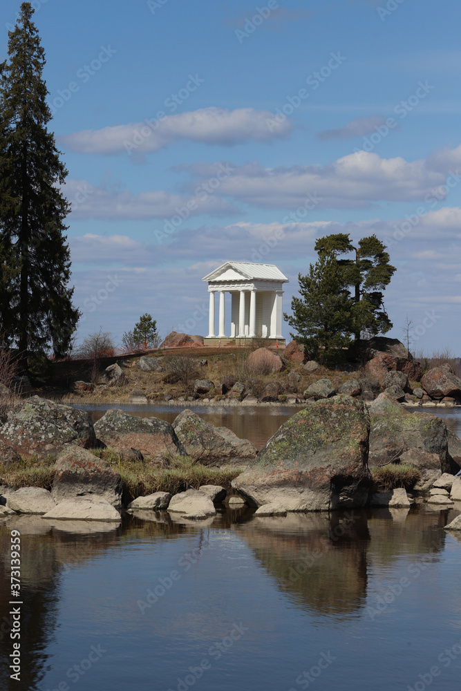 White building in classical style with columns on the shore of the Gulf of Finland White building in classical style with columns on the shore of the Gulf of Finland