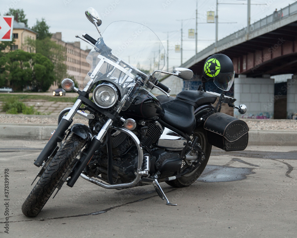 Black motorcycle on parking under the bridge Black motorcycle on parking under the bridge