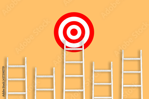 White stairs on an orange background and a target. Striving for goals, success and achievements. Career ladder. The concept of leadership in business and at work photo