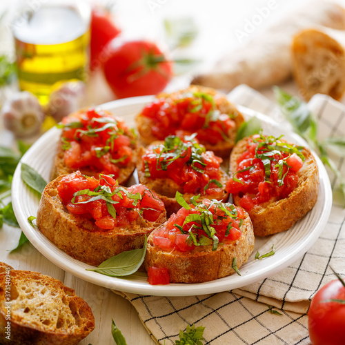 Bruschetta with tomato and basil, traditional Italian appetizer.