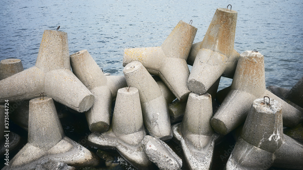 Picture of old coastal concrete breakwater tetrapods.