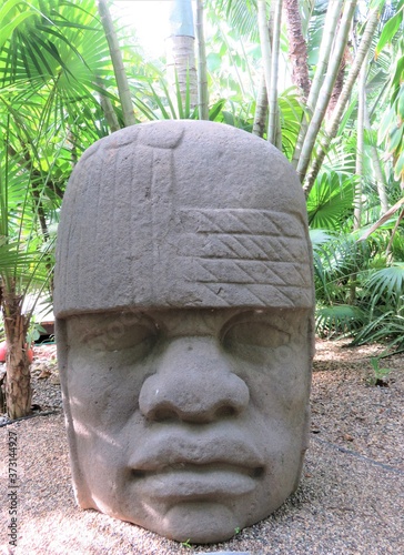 olmec head statue in the park photo
