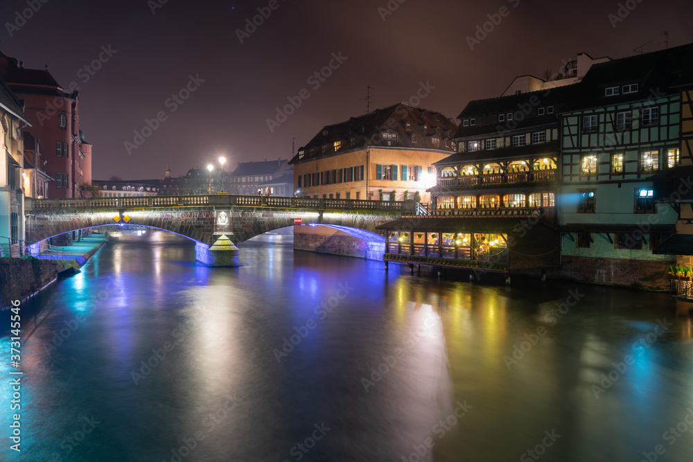 Quaint timbered houses of Petite France in Strasbourg, France. French traditional houses at night