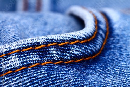 Background of blue indigo denim jeans and stiching photo