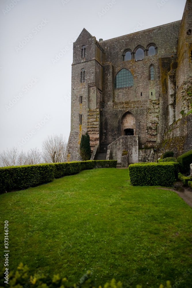 Ancient impregnable abbey fortress on an island in normandy Ancient impregnable abbey fortress on an island in normandy