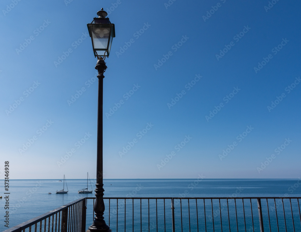 a street lamp on the seafront