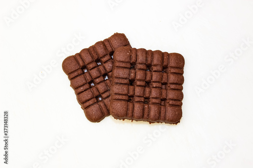 Two delicious chocolate cookies on a white background.
