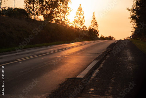 Silhouette of federal highway to the south of Brazil and the sunset background