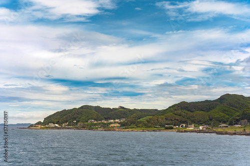 Coast of the Bōsō Peninsula from the ferry sailing on the Uraga Channel with the Kanaya town at the foot of the Mount Nokogiri.