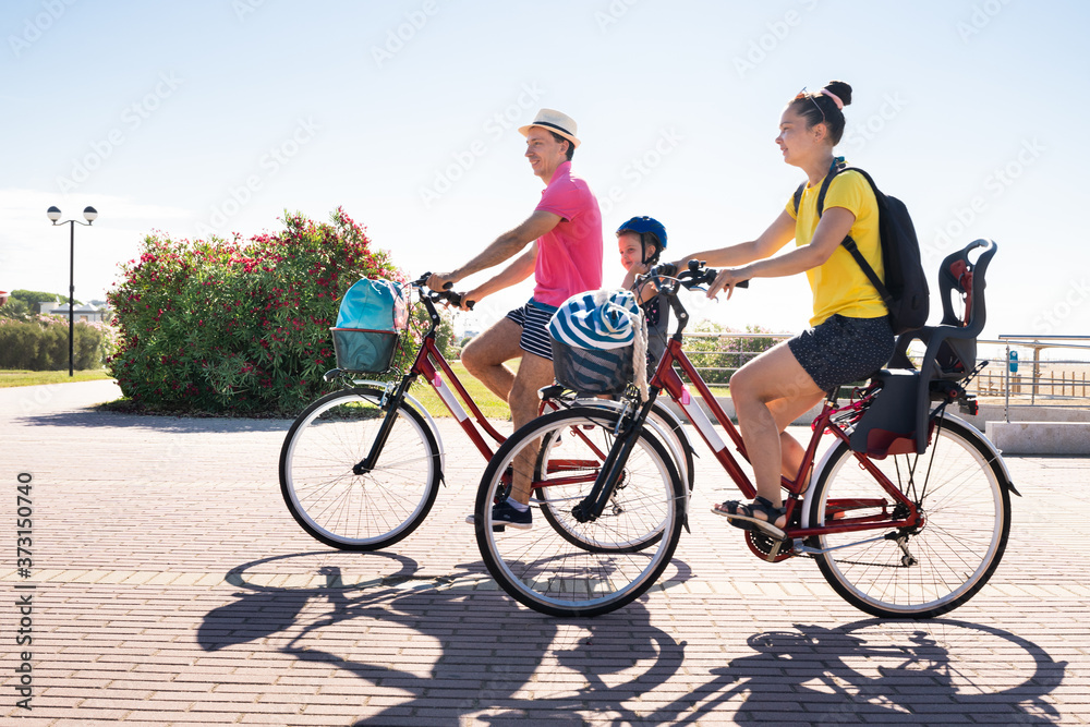 Family Riding Bicycle Outside