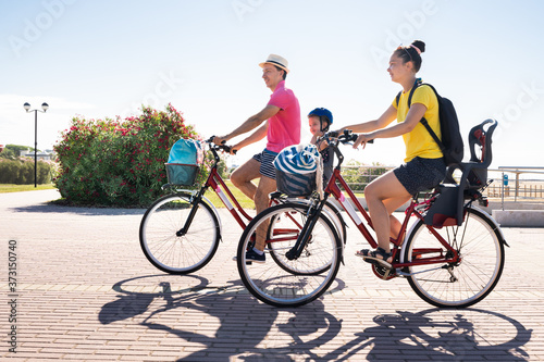 Family Riding Bicycle Outside