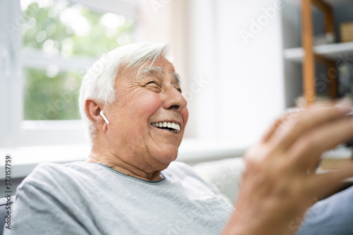 Smiling Older Senior Listening Music