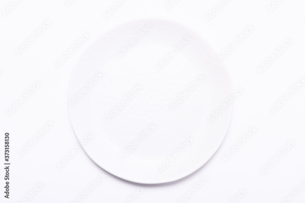 Ceramic plate on a white background. Top view Ceramic plate on a white background. Top view