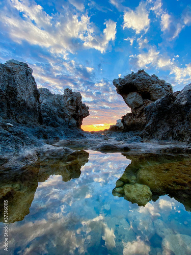sunset rocks in the water