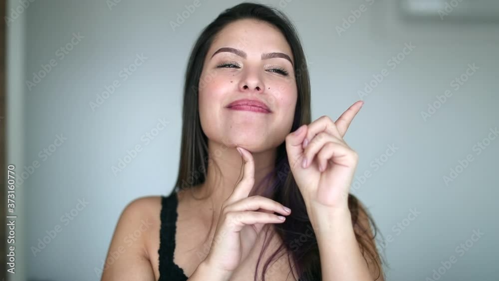 Thinking Beautiful woman having an idea. Clever attractive girl having a plan pointing with finger Thinking Beautiful woman having an idea. Clever attractive girl having a plan pointing with finger