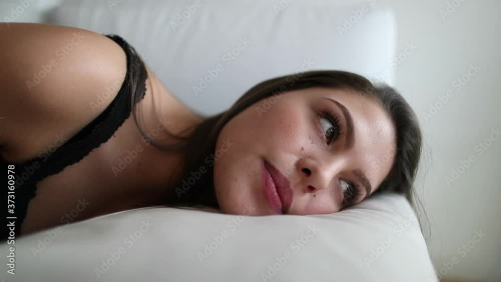 Thoughtful pensive young woman resting lying on couch Thoughtful pensive young woman resting lying on couch