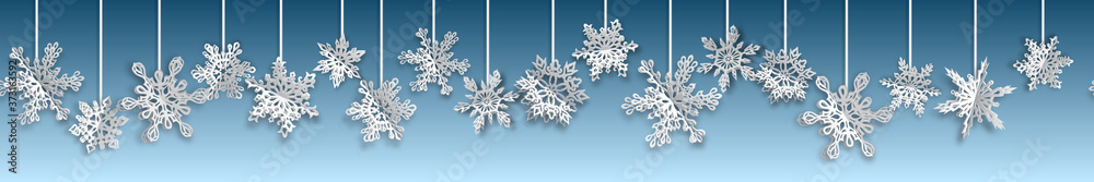 Christmas seamless banner with volume paper snowflakes with soft shadows on light blue background. With horizontal repetition Christmas seamless banner with volume paper snowflakes with soft shadows on light blue background. With horizontal repetition