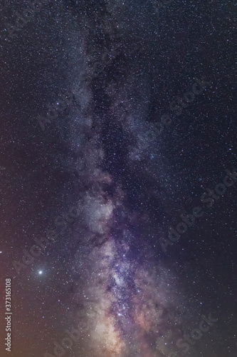 Milky way and falling meteorites in the night sky