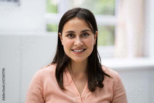 Smiling Young Woman Portrait At Workplace