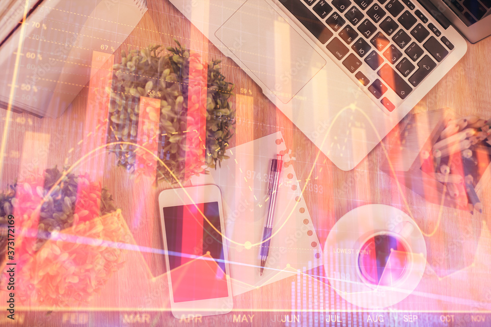 Fototapeta premium Multi exposure of financial chart hologram over desktop with phone. Top view. Mobile trade platform concept.