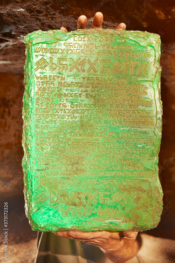 Detail of mysterious artifact emerald tablet found by adventurer in cave  Stock Photo | Adobe Stock