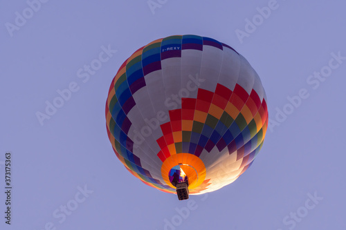 Hot air balloon flying at low altitude