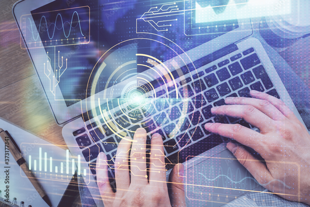 Multi exposure of man's hands typing over computer keyboard and data theme hologram drawing. Top view. Technology concept. Multi exposure of man's hands typing over computer keyboard and data theme hologram drawing. Top view. Technology concept.