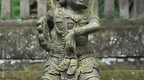 Bali, Indonesia - Kemenuh Monkey River and Jungle in Gianyar  - Beautiful Traditional Balinese Statue Statues Hindu Gods Prayer Temple photo