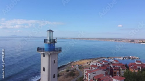 Lighthouse and bad weather in background,aerial view