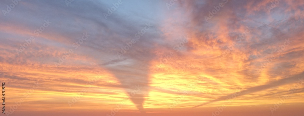 Super Sunset with a tornado shaped cloud