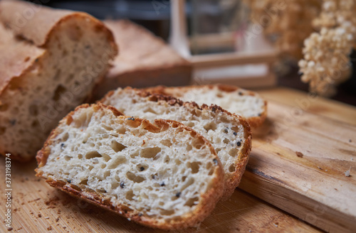 Sliced homemade bread on wooden board