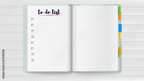 Realistic opened notebook with clean to do list and colored bookmarks on wooden desk. Vector 3d illustration.
