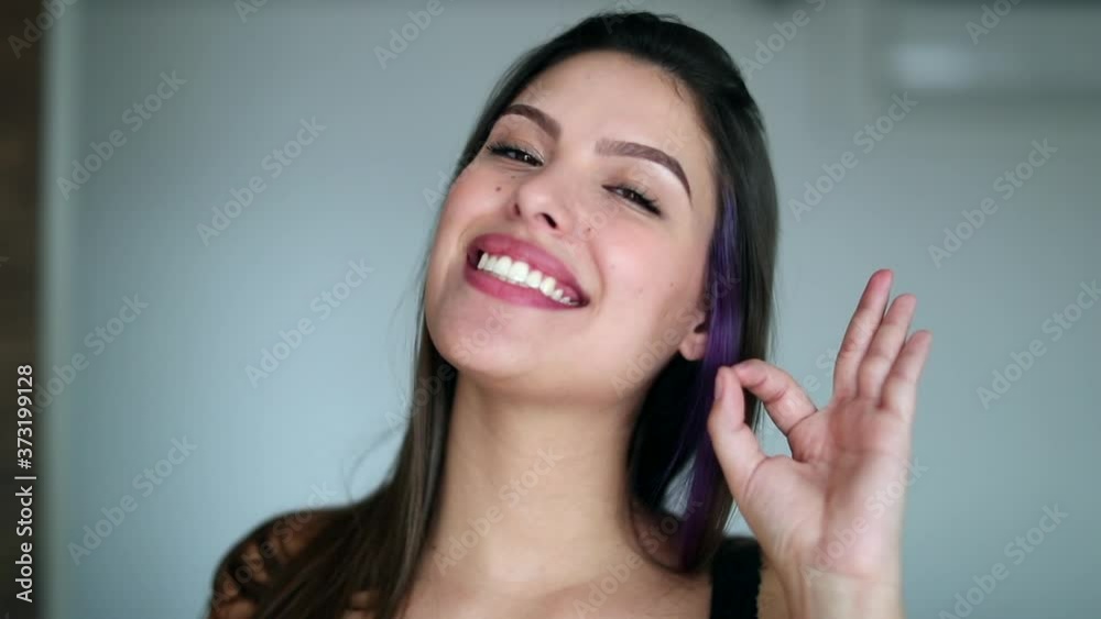Young woman approval gesture with hand. Pretty girl giving OK sign Young woman approval gesture with hand. Pretty girl giving OK sign