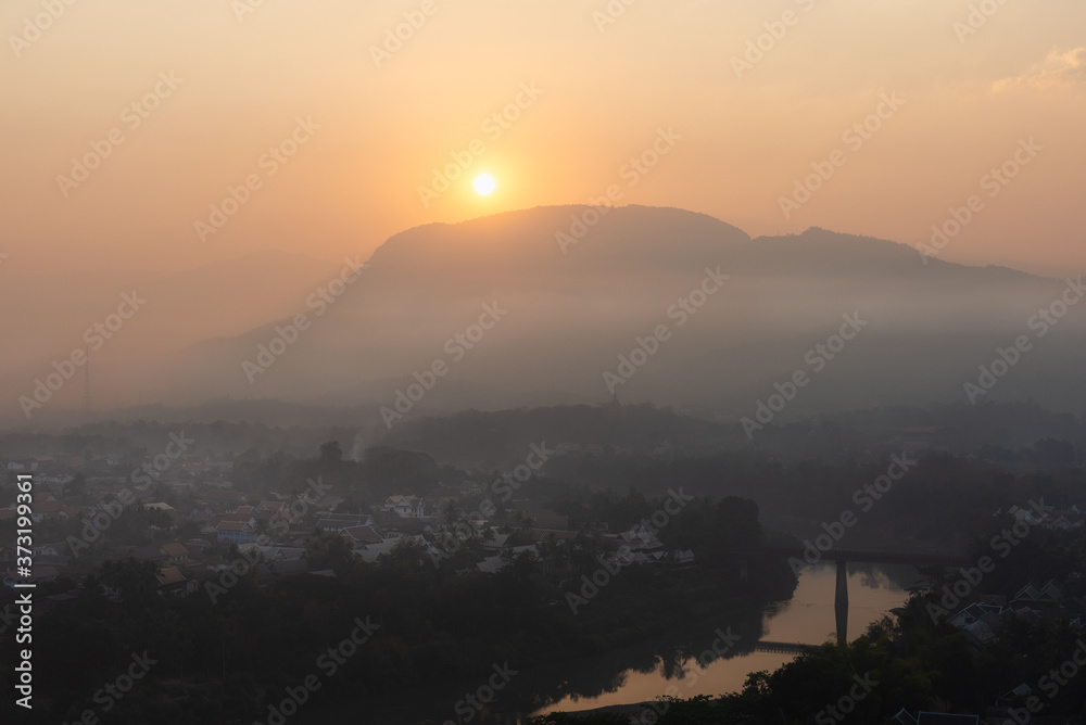 Sunrise and mist over Luang Prabang, Laos from Mount Phousi