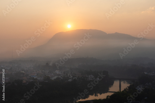 Sunrise and mist over Luang Prabang, Laos from Mount Phousi © Mark