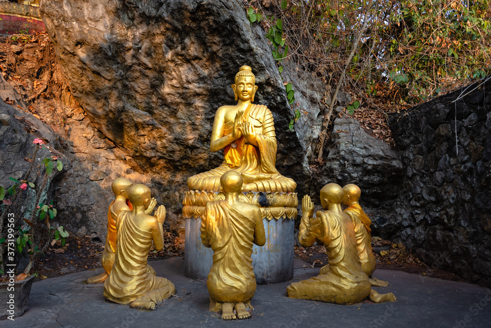 Gold buddha statue at Mount Phousi in Luang Prabang, Laos