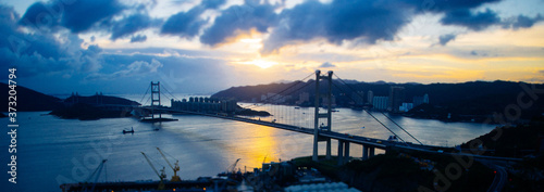 Beautiful Tsing Ma Bridge gleaming under the sunset in Hong Kong photo