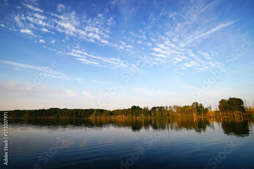 lake and blue sky with clouds in the morning