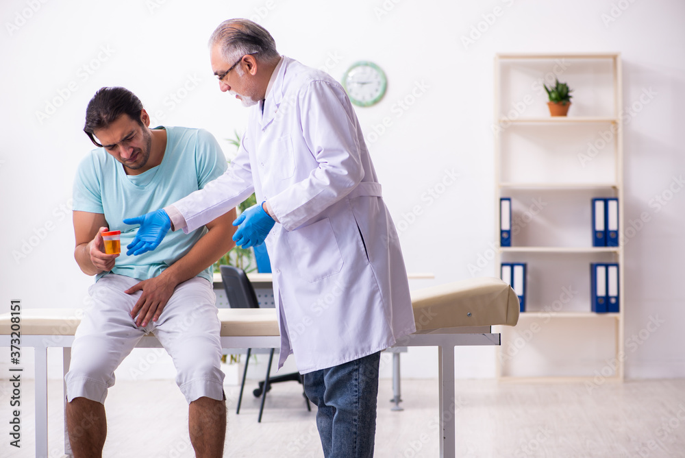 Young male patient visiting experienced doctor Young male patient visiting experienced doctor