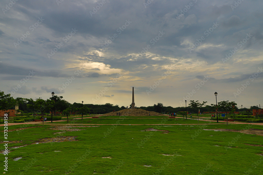 A beautiful scenery of the greenery and reflection in coronation park  delhi