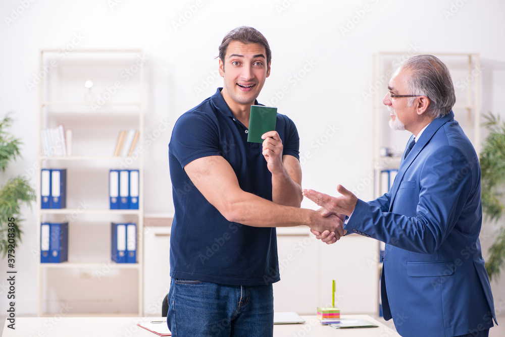 Fototapeta premium Young man visiting embassy for visa application