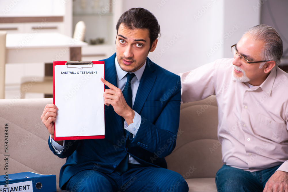 Young male lawyer visiting old man in testament concept Young male lawyer visiting old man in testament concept