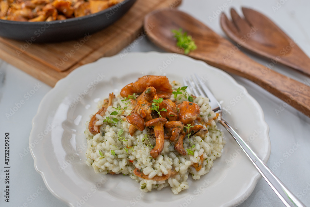 home made Risotto with chanterelle mushrooms and herbs