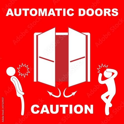 Automatic doors sign with the text caution